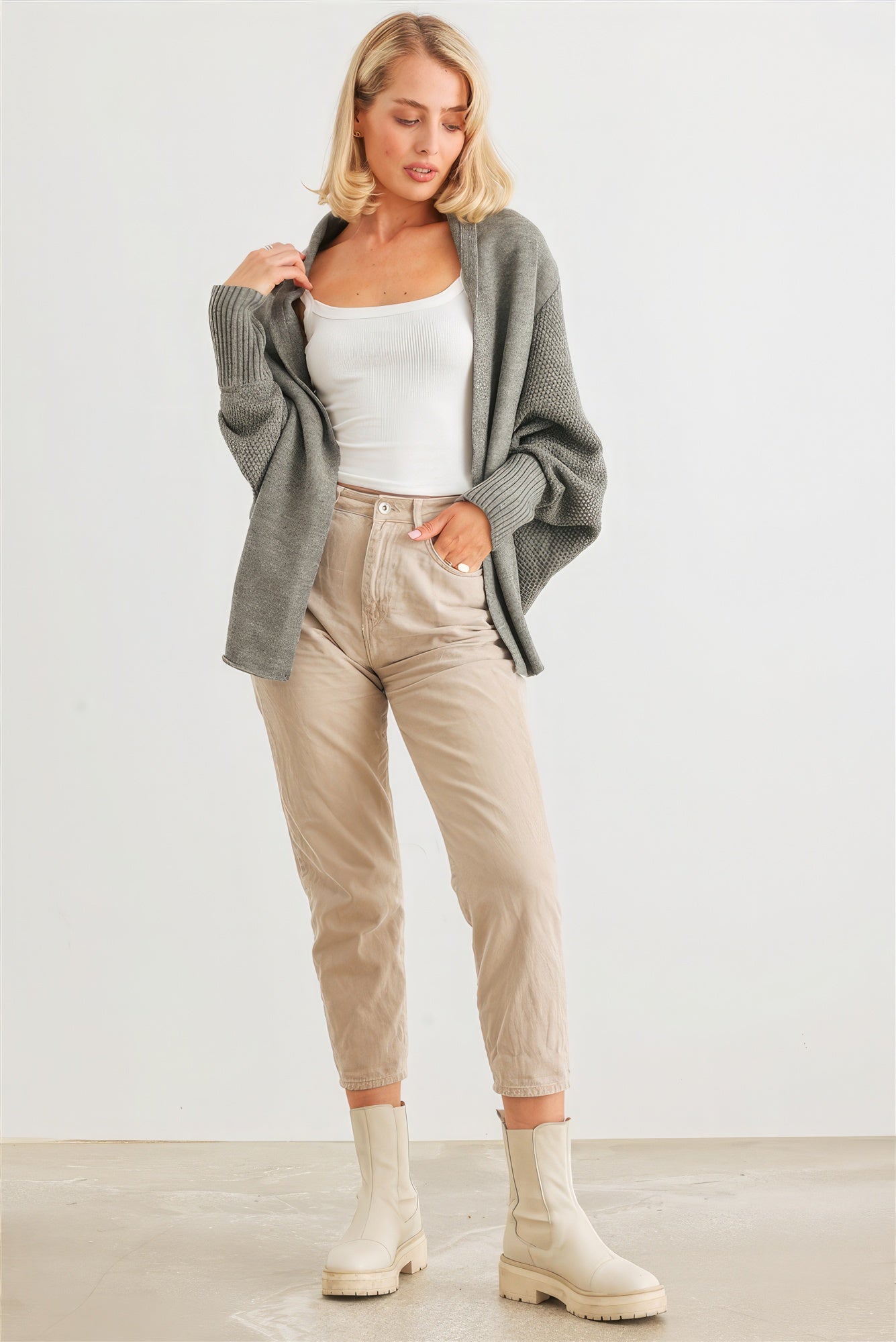 The Chelsea is our batwing sleeve open front cardigan. Designed to keep you warm and relaxed, it is perfect for layering over your favourite outfits. Ideal for casual outings and cozy evenings. Fabric: 100% Acrylic. Colour: heather charcoal.