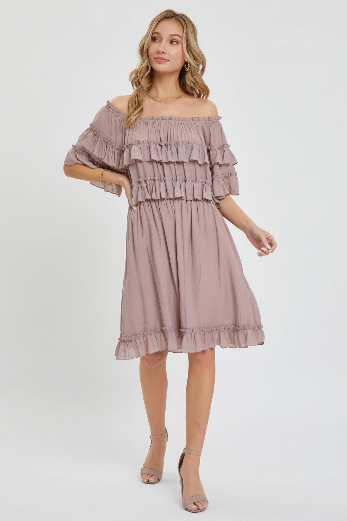 The Kayla is a relaxed-fit, bohemian-style dress that effortlessly combines elegance and comfort. This off-shoulder, short-sleeve dress features an elastic waist, a ruffle bottom, and a feminine silhouette. Crafted from 100% polyester, The Kayla is both soft and lightweight. This enchanting dark mauve dress is ideal for casual weddings, outdoor gatherings and beach vacations.