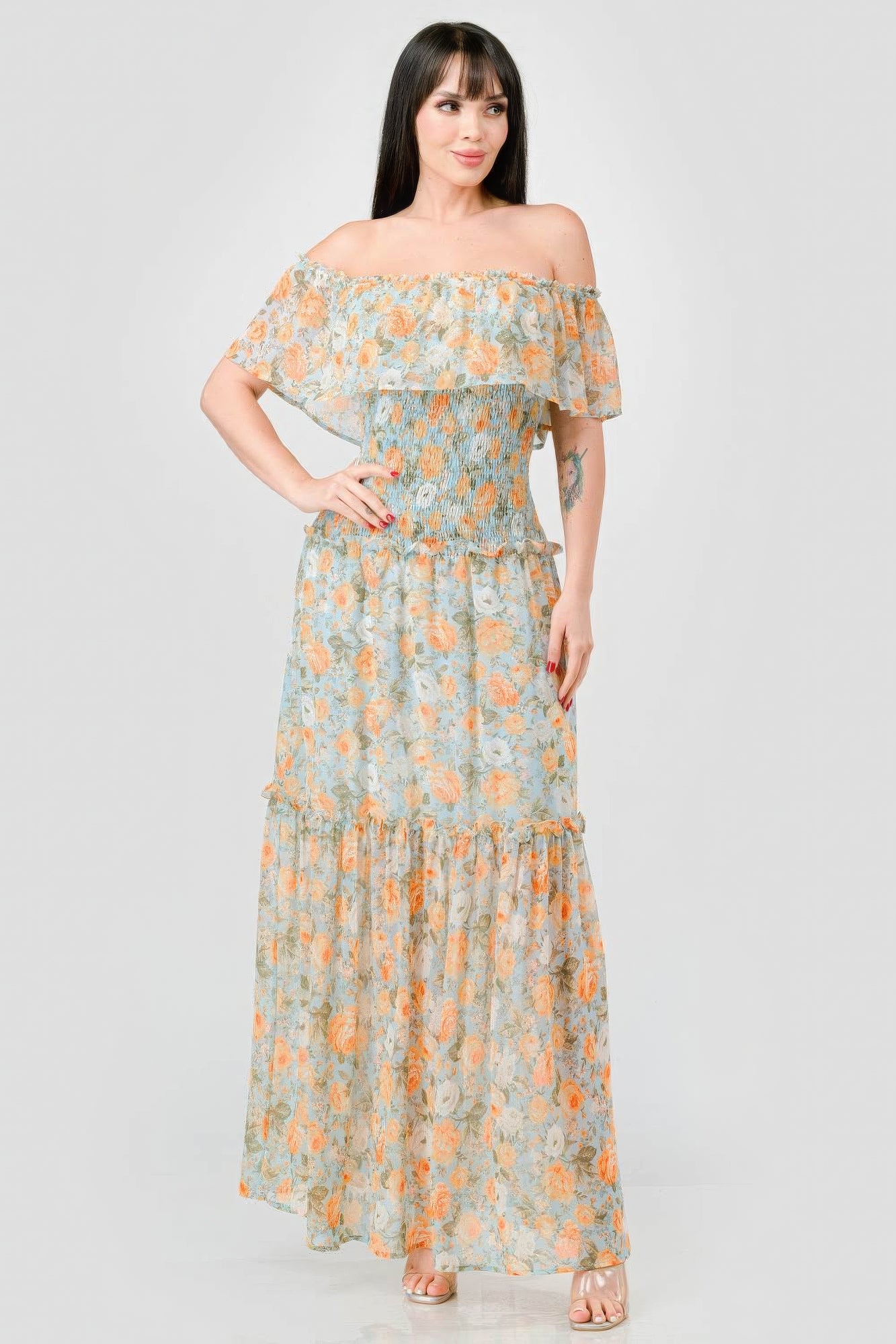 Elevate your wardrobe with The Sage, our floral chiffon maxi dress. It is a stunning piece that exudes elegance and grace. Crafted from 100% Polyester, this dress offers a lightweight and luxurious feel for all-day comfort. Made from high-quality chiffon fabric, The Sage ensures a delicate and flowy silhouette. It features an off-shoulder neckline with a smocked back and ruffled tiered detailing, offering a romantic and feminine look. Perfect for a range of occasions.