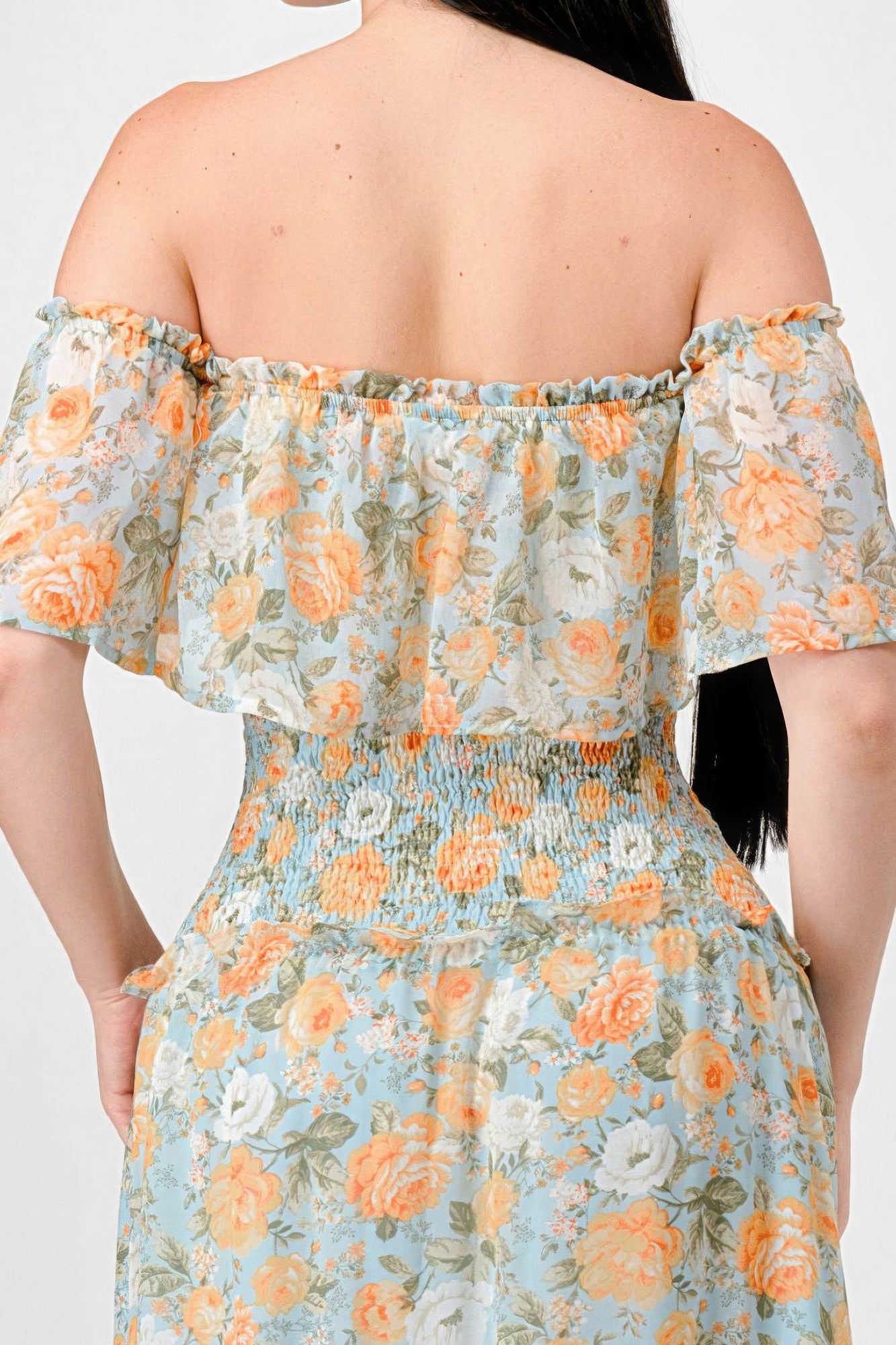 Elevate your wardrobe with The Sage, our floral chiffon maxi dress. It is a stunning piece that exudes elegance and grace. Crafted from 100% Polyester, this dress offers a lightweight and luxurious feel for all-day comfort. Made from high-quality chiffon fabric, The Sage ensures a delicate and flowy silhouette. It features an off-shoulder neckline with a smocked back and ruffled tiered detailing, offering a romantic and feminine look. Perfect for a range of occasions.