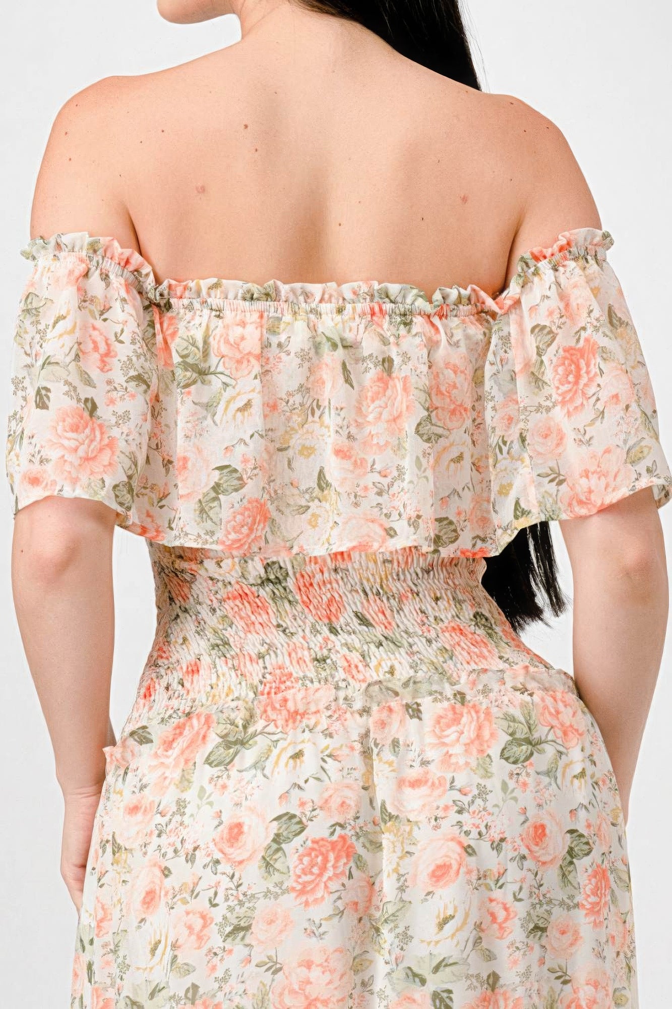 Elevate your wardrobe with The Sage, our floral chiffon maxi dress. It is a stunning piece that exudes elegance and grace. Crafted from 100% Polyester, this dress offers a lightweight and luxurious feel for all-day comfort. Made from high-quality chiffon fabric, The Sage ensures a delicate and flowy silhouette. It features an off-shoulder neckline with a smocked back and ruffled tiered detailing, offering a romantic and feminine look. Perfect for a range of occasions, from garden parties to beach weddings.