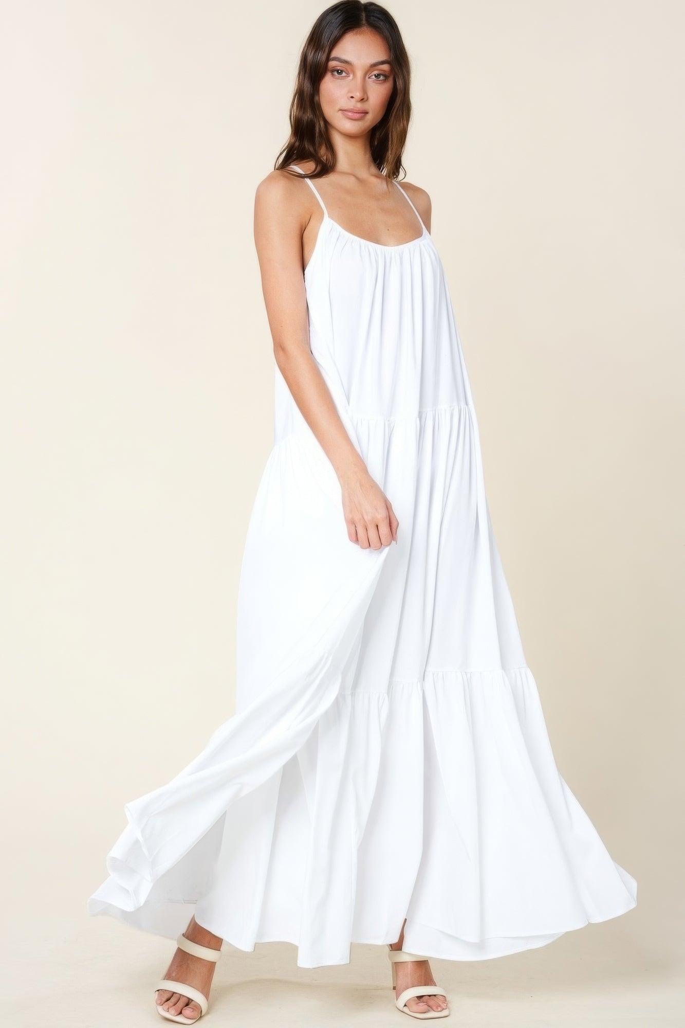 The Tessa is our maxi sun dress with pockets. It features adjustable straps and an extra-wide A-line silhouette. Perfect for beach outings, vacations, or casual gatherings. Fabric: Made from 100% polyester. Colour: white.