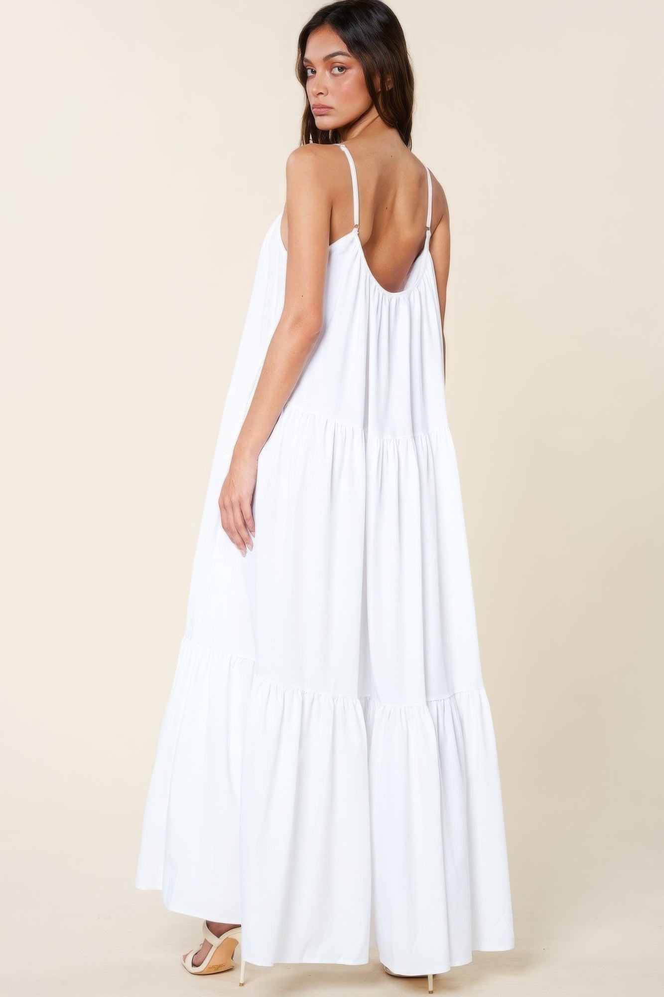 The Tessa is our maxi sun dress with pockets. It features adjustable straps and an extra-wide A-line silhouette. Perfect for beach outings, vacations, or casual gatherings. Fabric: Made from 100% polyester. Colour: white.