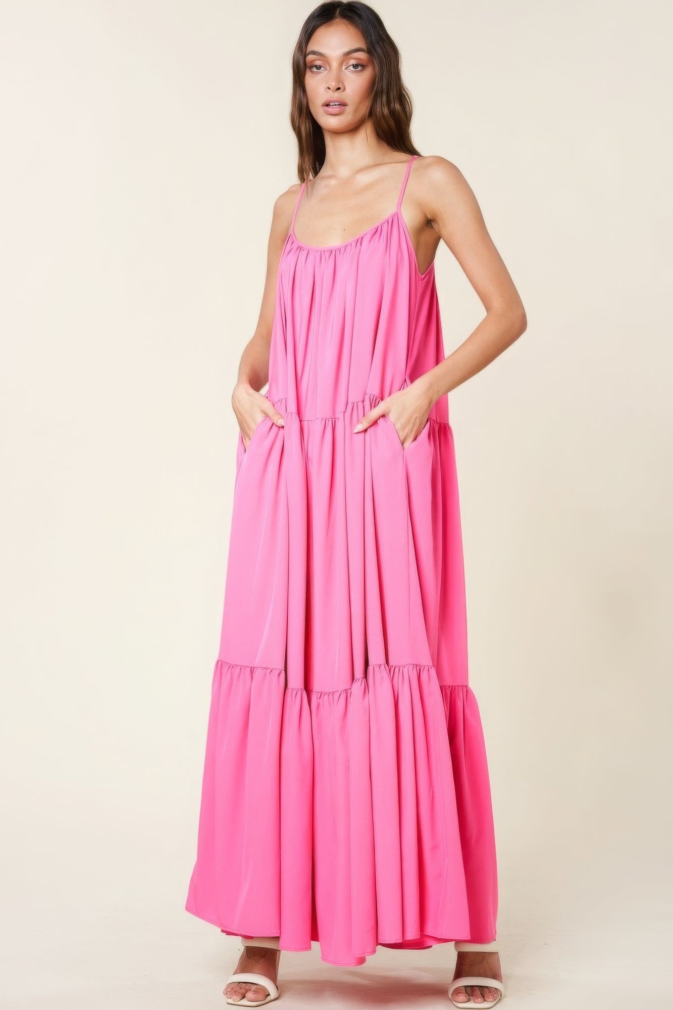 The Tessa is our maxi sun dress with pockets. It features adjustable straps and an extra-wide A-line silhouette. Perfect for beach outings, vacations, or casual gatherings. Fabric: Made from 100% polyester. Colour: pink.
