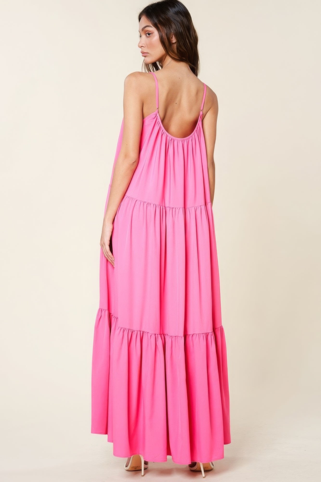 The Tessa is our maxi sun dress with pockets. It features adjustable straps and an extra-wide A-line silhouette. Perfect for beach outings, vacations, or casual gatherings. Fabric: Made from 100% polyester. Colour: pink.