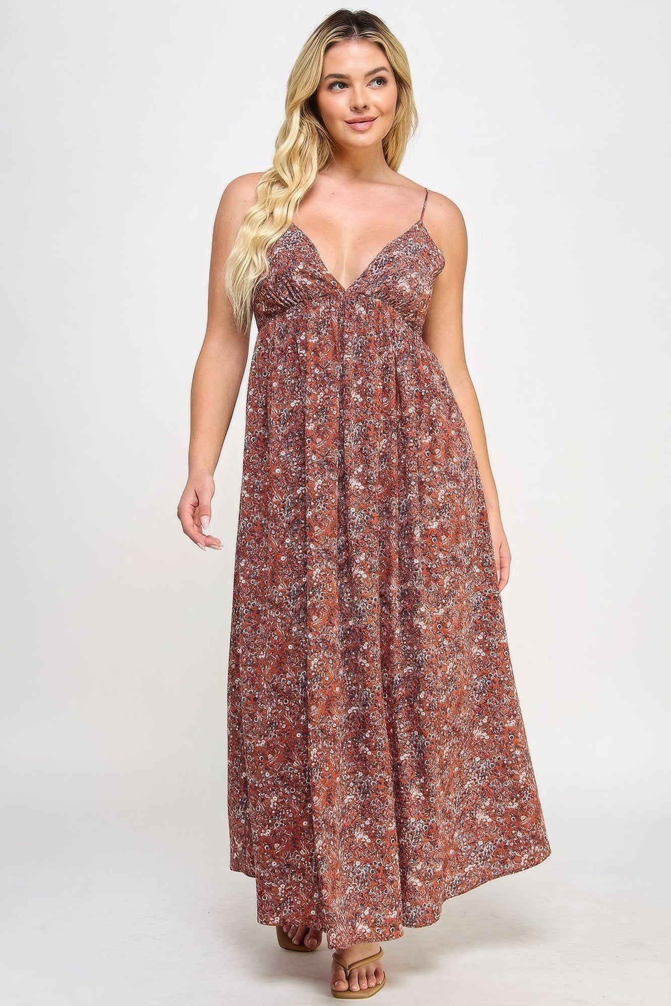 The Talia is our plus size floral maxi dress with a gorgeous tie back. This stunning piece is meticulously crafted to show your flattering silhouette. Perfect for special occasions or everyday wear. Fabric: Made from 100% polyester. Colour: Rust.