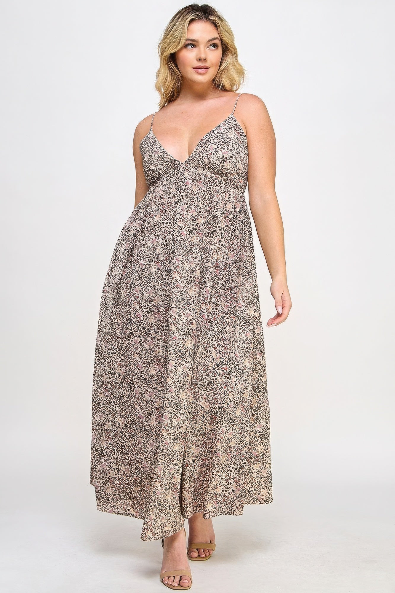 The Talia is our plus size floral maxi dress with a gorgeous tie back. This stunning piece is meticulously crafted to show your flattering silhouette. Perfect for special occasions or everyday wear. Fabric: Made from 100% polyester. Colour: Taupe.