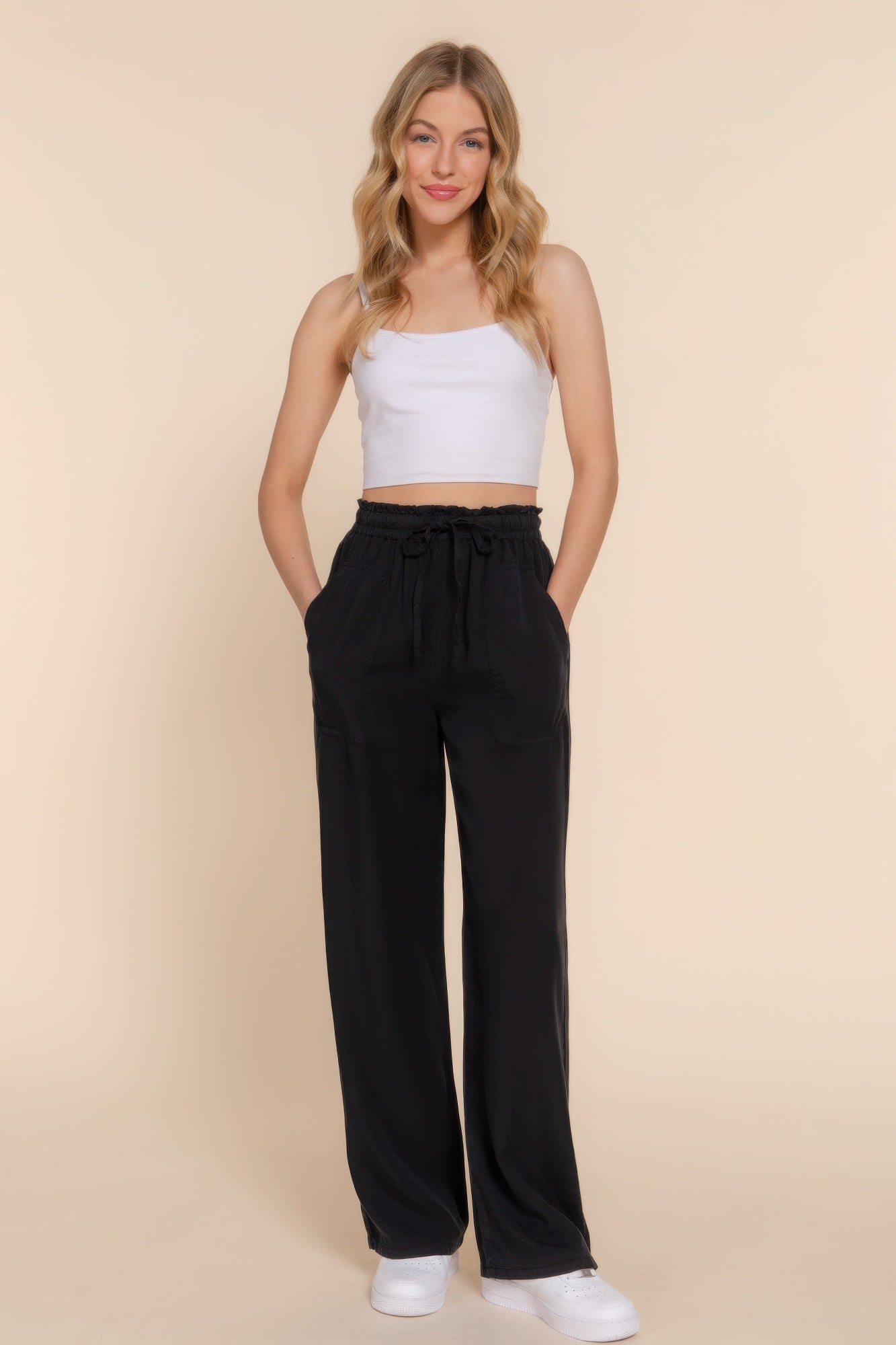 The Winona is our elastic waist Tencel fiber long pants, crafted for both comfort and style. These pants are known for their softness and sustainability. Perfect for various occasions from casual outings to relaxed work environments. Fabric: Made from 100% Tencel. Colour: black.