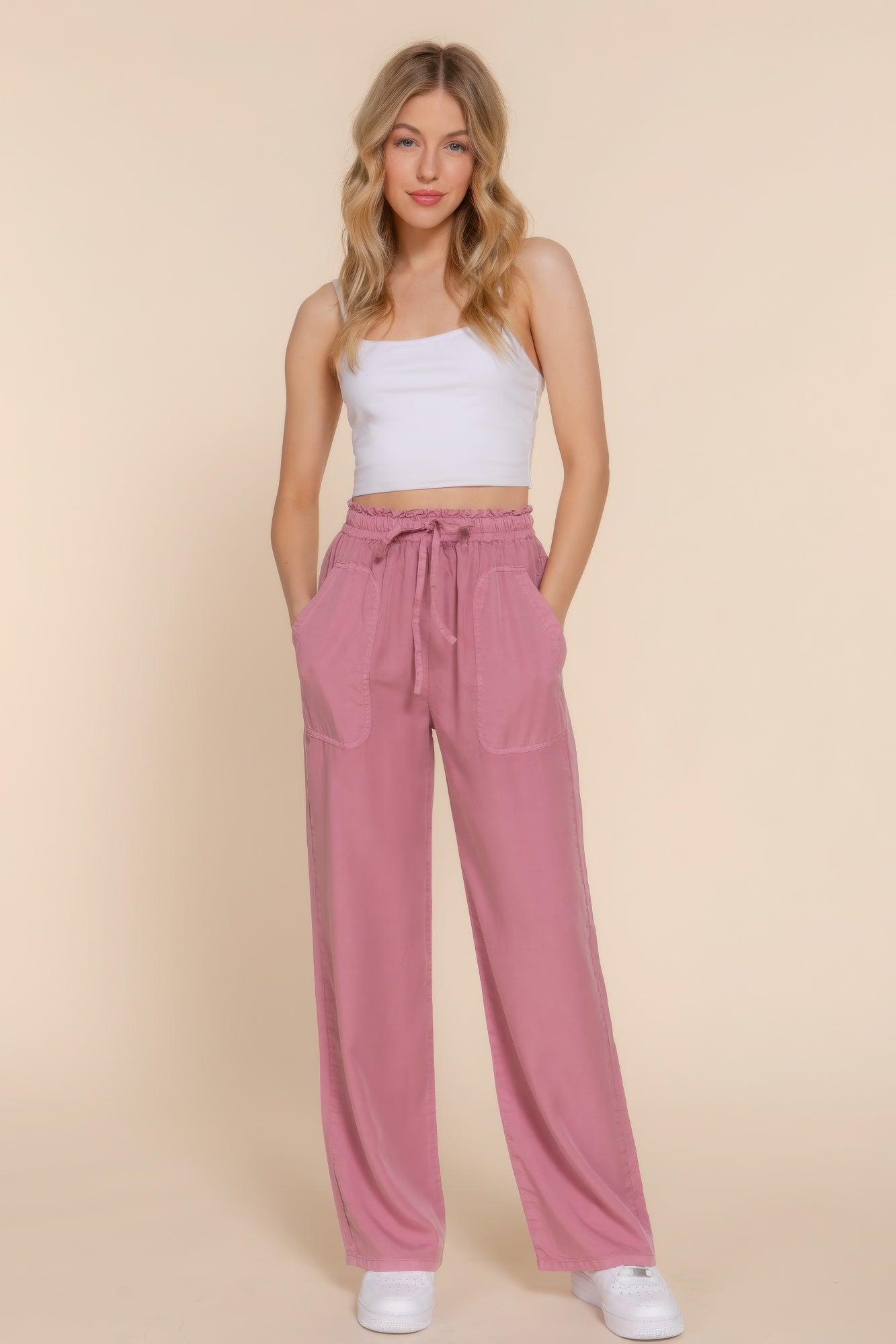 The Winona is our elastic waist Tencel fiber long pants, crafted for both comfort and style. These pants are known for their softness and sustainability. Perfect for various occasions from casual outings to relaxed work environments. Fabric: Made from 100% Tencel. Colour: mauve.