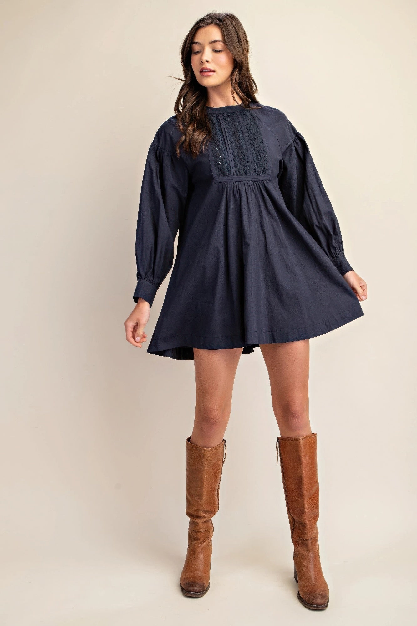 The Lacy is our long sleeve mini dress with a beautiful lace detail. Crafted from high-quality cotton, this elegant dress combines a classic design with contemporary comfort and a luxurious feel. Perfect for casual outings, evening events, or any occasion where you want to look stylish and feel comfortable. Fabric: Made from 100% cotton. Colour: navy.