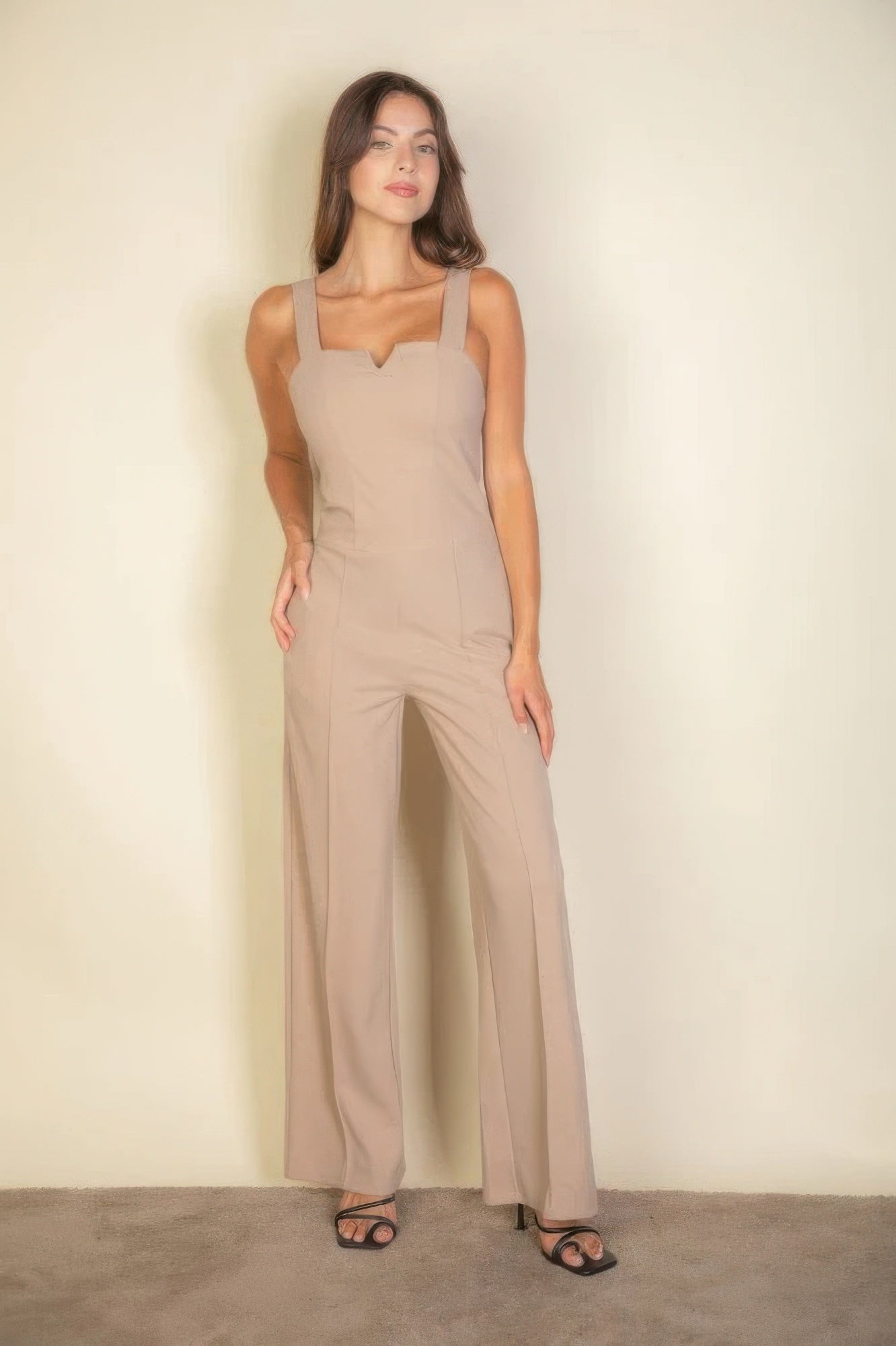 The Jane is our notched neck cami jumpsuit which combines comfort with a chic design. Its soft, stretchy fabric ensures a flattering fit and all-day comfort, making it ideal for casual outings, daily wear, or special occasions. Fabric: Made from 96% polyester and 4% spandex. Colour: Taupe.