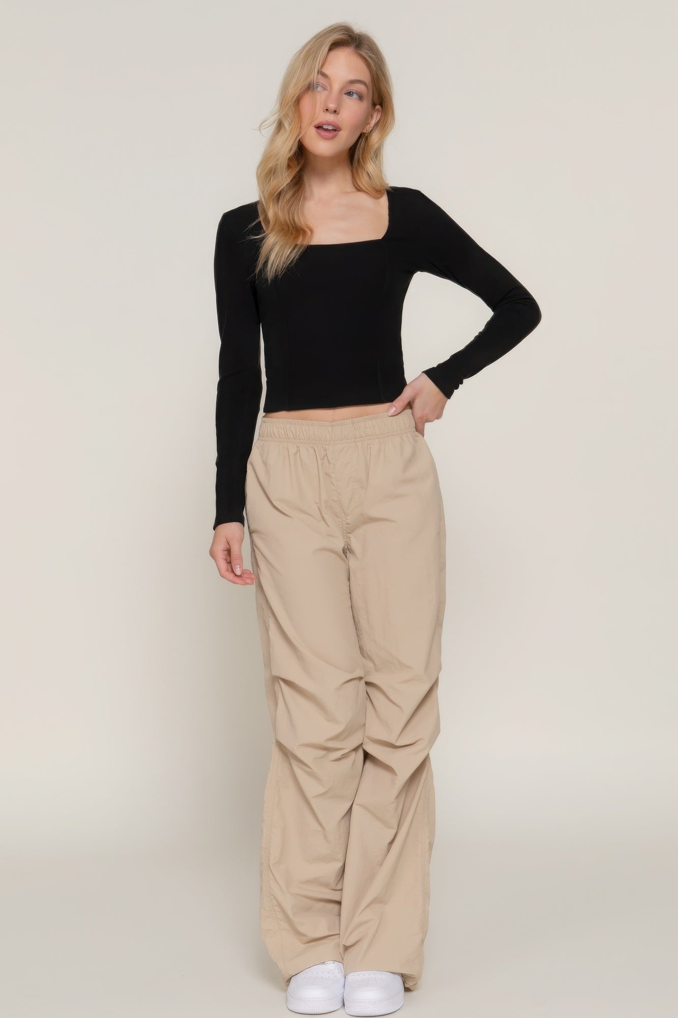 Elevate your style with the Long Sleeve Sweetheart Neck Seam Detail Knit Top in classic black. This elegant top features a sweetheart neckline and detailed seam accents, making it a sophisticated addition to any wardrobe. It offers both comfort and a flattering fit. Fabric: Made from 92% polyester and 6% spandex. Black top.