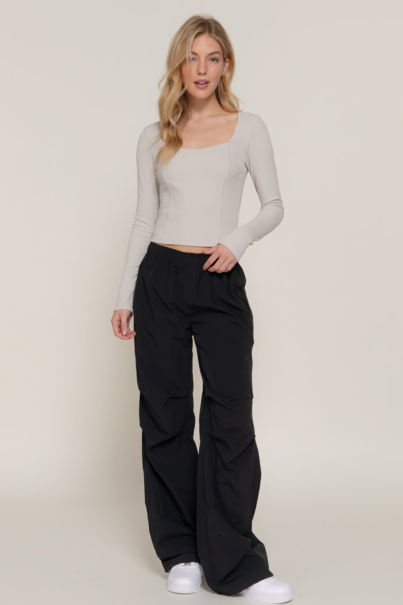Elevate your style with the Long Sleeve Sweetheart Neck Seam Detail Knit Top in classic black. This elegant top features a sweetheart neckline and detailed seam accents, making it a sophisticated addition to any wardrobe. It offers both comfort and a flattering fit. Fabric: Made from 92% polyester and 6% spandex. Silver top.