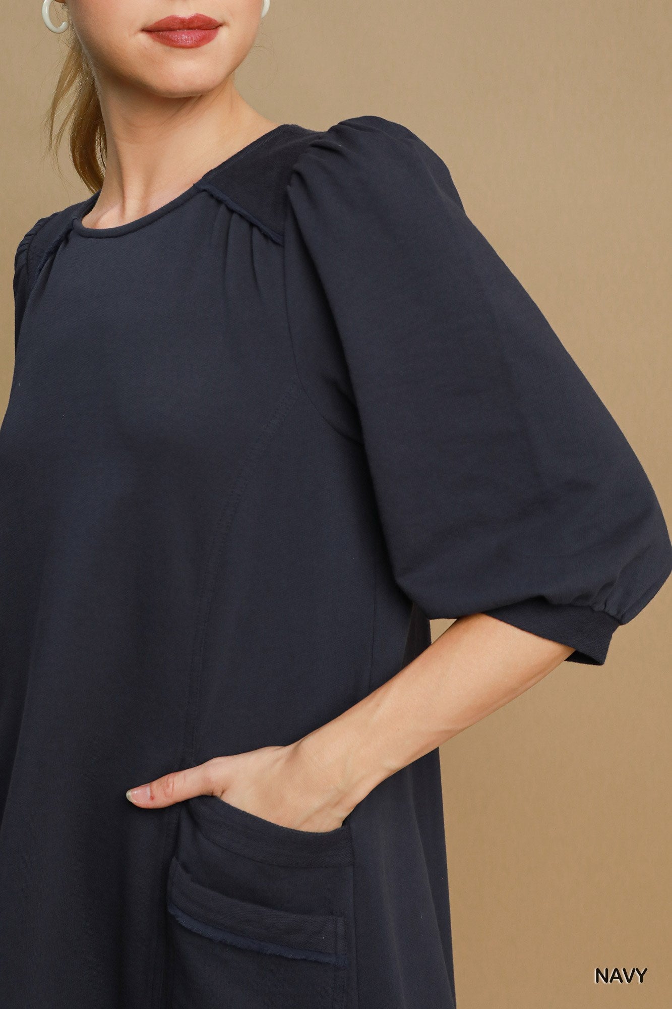 The Terry is a mini dress crafted from soft French Terry fabric. It offers a perfect blend of comfort and style. It features double pockets, frayed trim details and a relaxed fit. The dress is not lined making it lightweight and ideal for layering. Fabric: 100% cotton. Colour: navy.