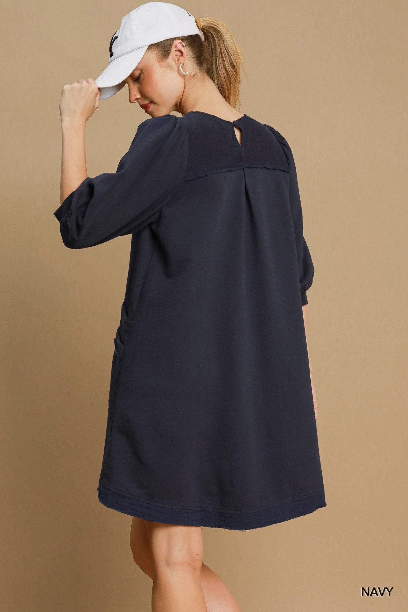 The Terry is a mini dress crafted from soft French Terry fabric. It offers a perfect blend of comfort and style. It features double pockets, frayed trim details and a relaxed fit. The dress is not lined making it lightweight and ideal for layering. Fabric: 100% cotton. Colour: navy.