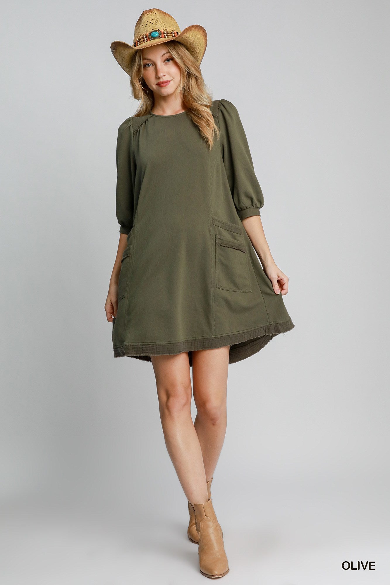 The Terry is a mini dress crafted from soft French Terry fabric. It offers a perfect blend of comfort and style. It features double pockets, frayed trim details and a relaxed fit. The dress is not lined making it lightweight and ideal for layering. Fabric: 100% cotton. Colour: olive.