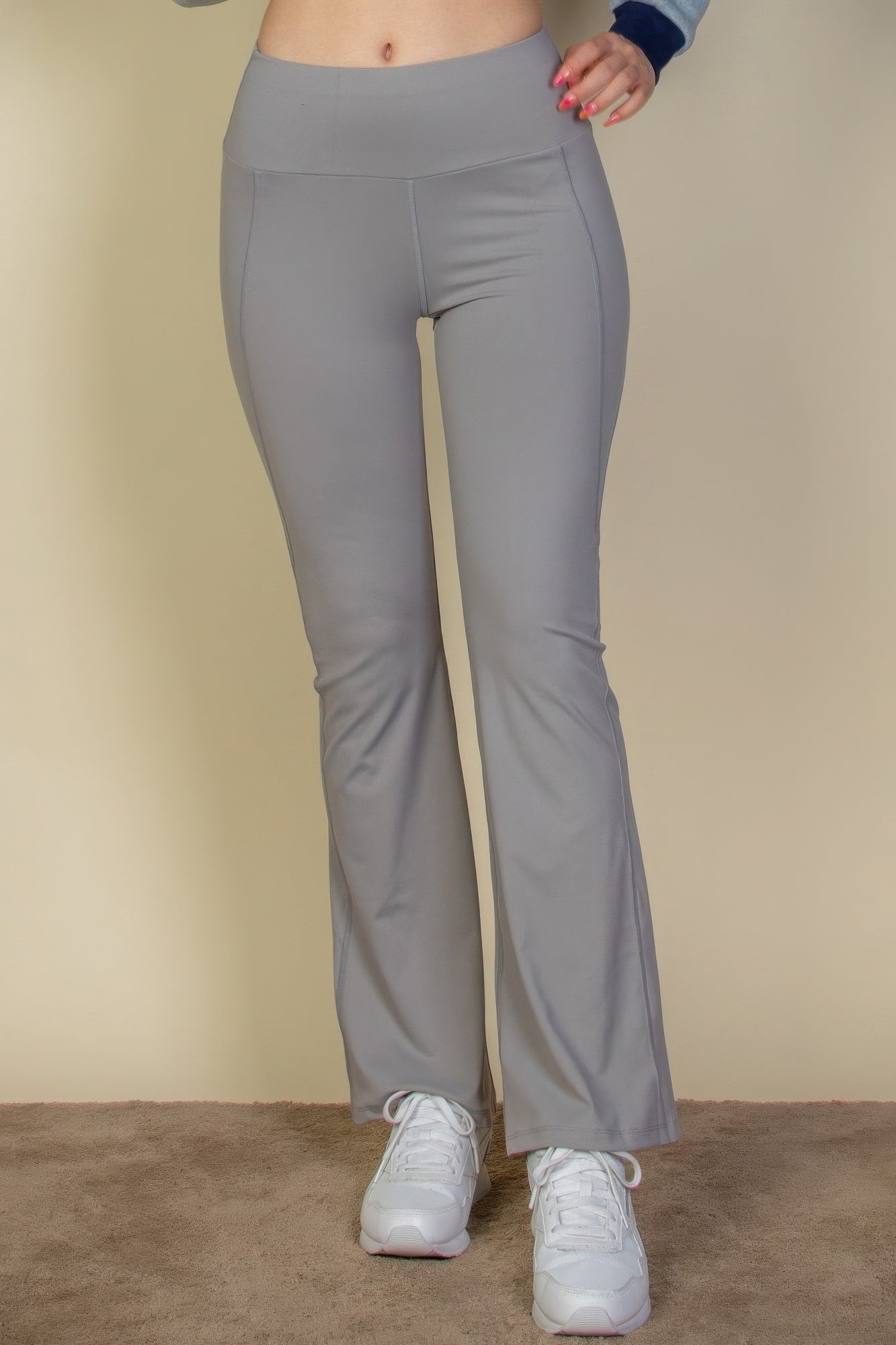 The Fiona is our wide waistband flare leg pants. These cute leggings are designed to offer both style and comfort, making them a versatile choice for any occasion. They can be paired with a fitted top for a polished look or a relaxed sweater for a more laid-back outfit. Crafted from a premium blend of 80% polyamide and 20% elastane. Colour: Cement.