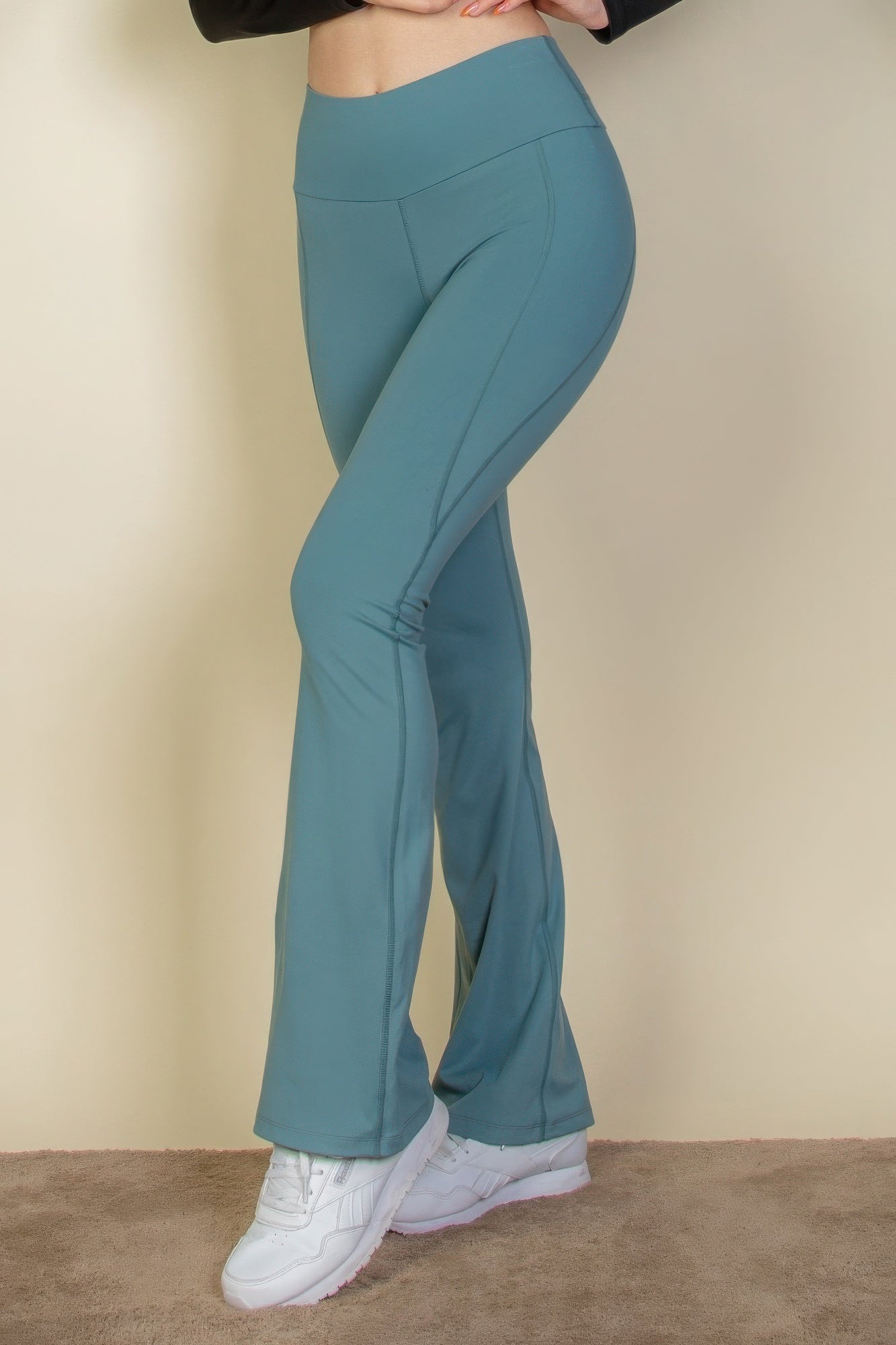 The Fiona is our wide waistband flare leg pants. These cute leggings are designed to offer both style and comfort, making them a versatile choice for any occasion. They can be paired with a fitted top for a polished look or a relaxed sweater for a more laid-back outfit. Crafted from a premium blend of 80% polyamide and 20% elastane. Colour: Slate Green.