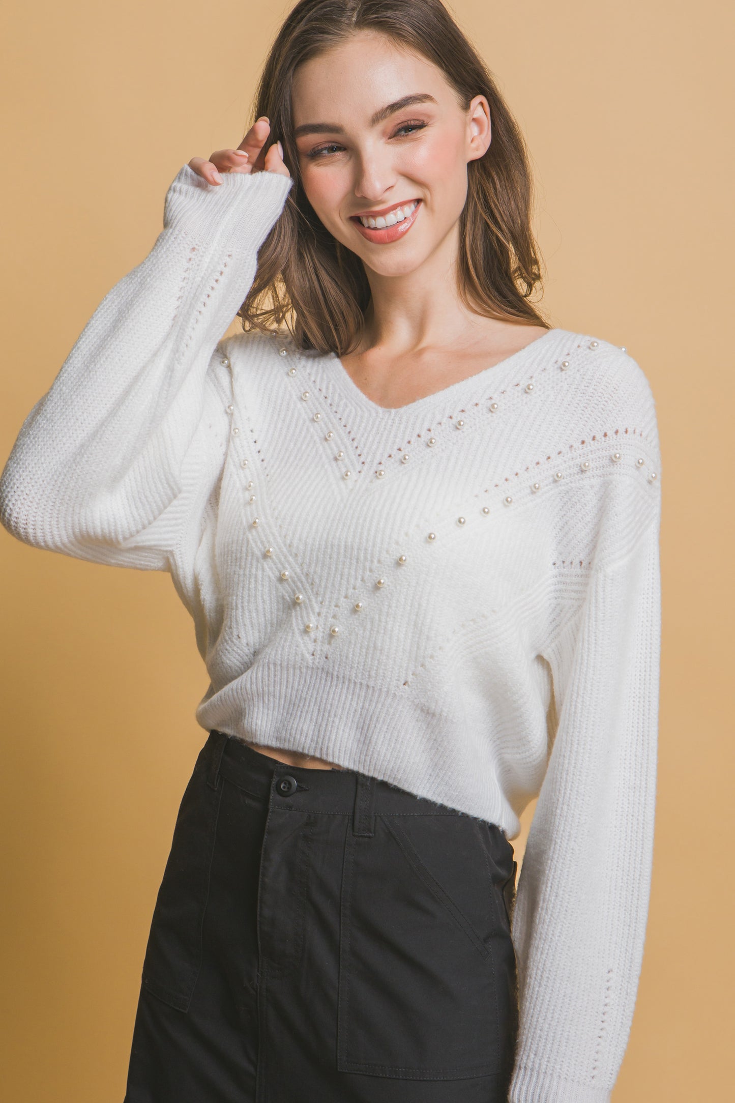 The Pearl is a luxurious and stylish piece that combines elegance with comfort. Crafted with a blend of high-quality materials, this sweater features an exquisite pearl detailing for a more sophisticated look. Designed for a comfortable and flattering fit and perfect for all-day wear. Fabric: Made from 89% polyester, 8% nylon, and 3% spandex. Colour: Off white.