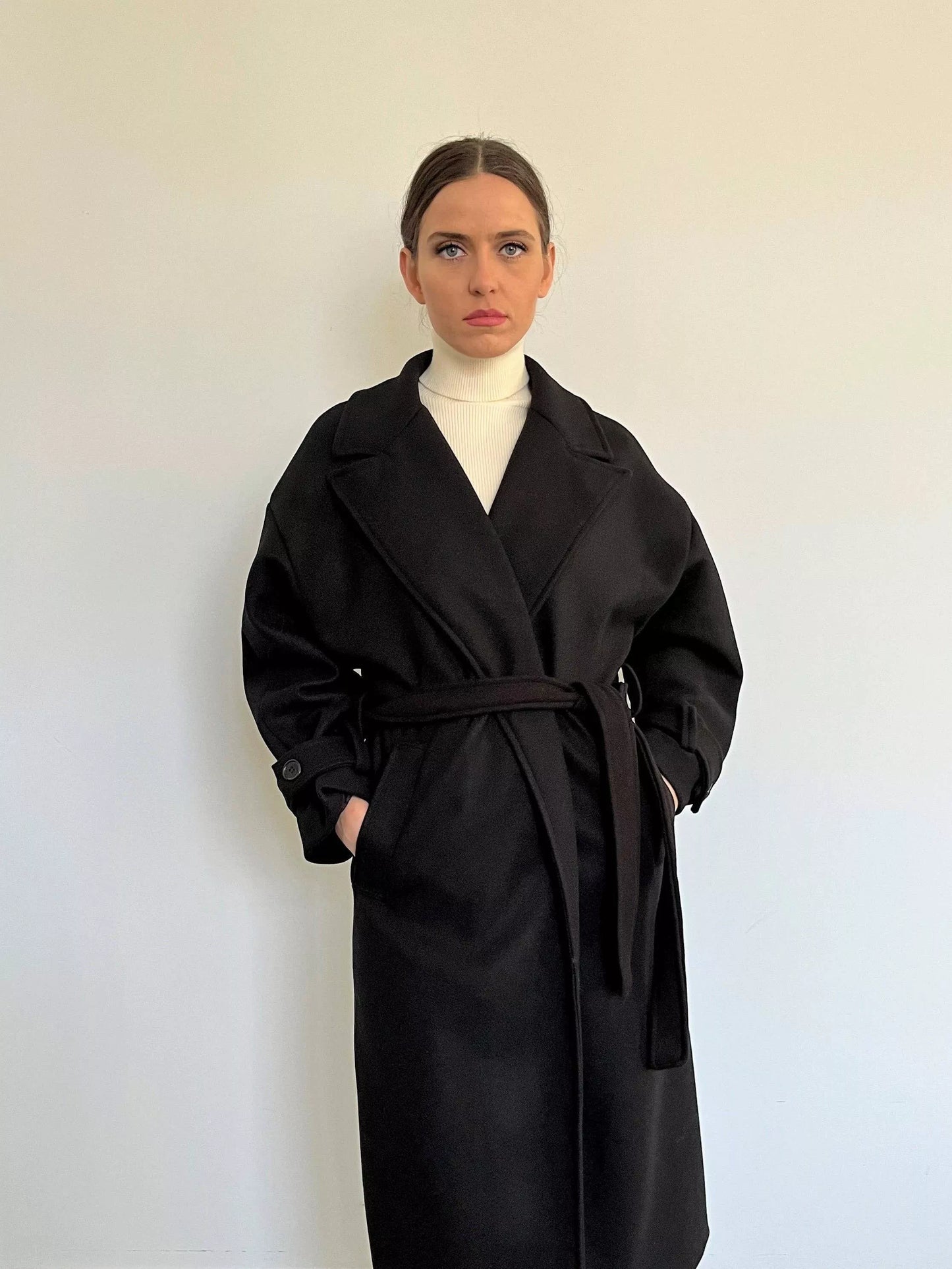 The Livia is a classic and timeless piece made in Italy. It is a must-have long coat for a fashionable winter. Colour: Black.