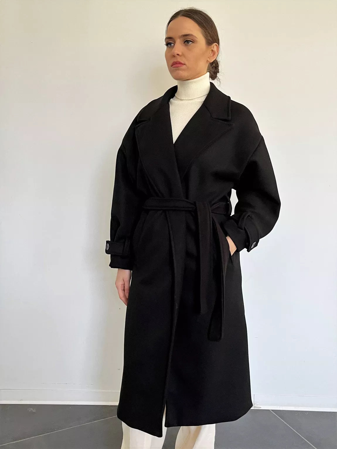 The Livia is a classic and timeless piece made in Italy. It is a must-have long coat for a fashionable winter. Colour: Black.