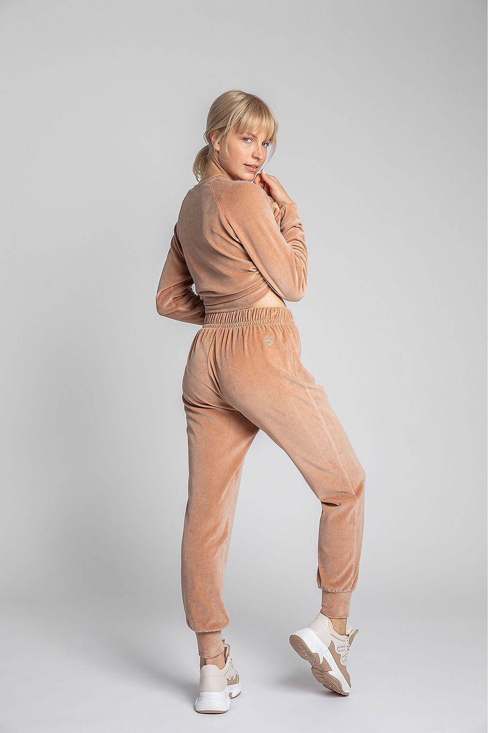 Unique light orange velour joggers. This slightly shiny cotton knit is pleasant to the touch and looks beautiful! Waistband with elastic.