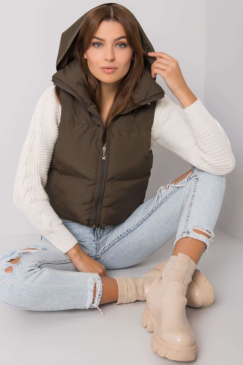 Zip fastened brown vest with a concealed hood.