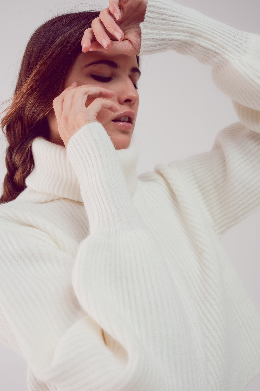 The White Winter Turtleneck Sweater is a must-have. This sweater boasts a cozy chunky knit fabric and stylish puff sleeves, blending comfort and fashion effortlessly. It's made from a blend of 45% Acrylic, 28% Polyamide, and 27% Polyester. With a standard fit that runs true to size, this sweater is designed to provide a comfortable and stylish look. Embrace the perfect combination of comfort and chic style.