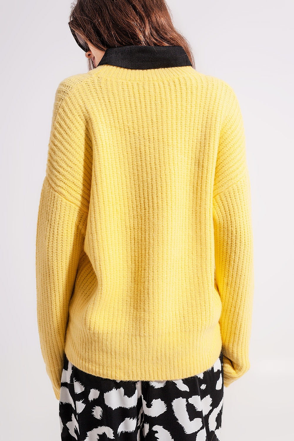 The Mellow Yellow is a casual, relaxed fit and ribbed chunky knit sweater with a crew neckline and long sleeves.
