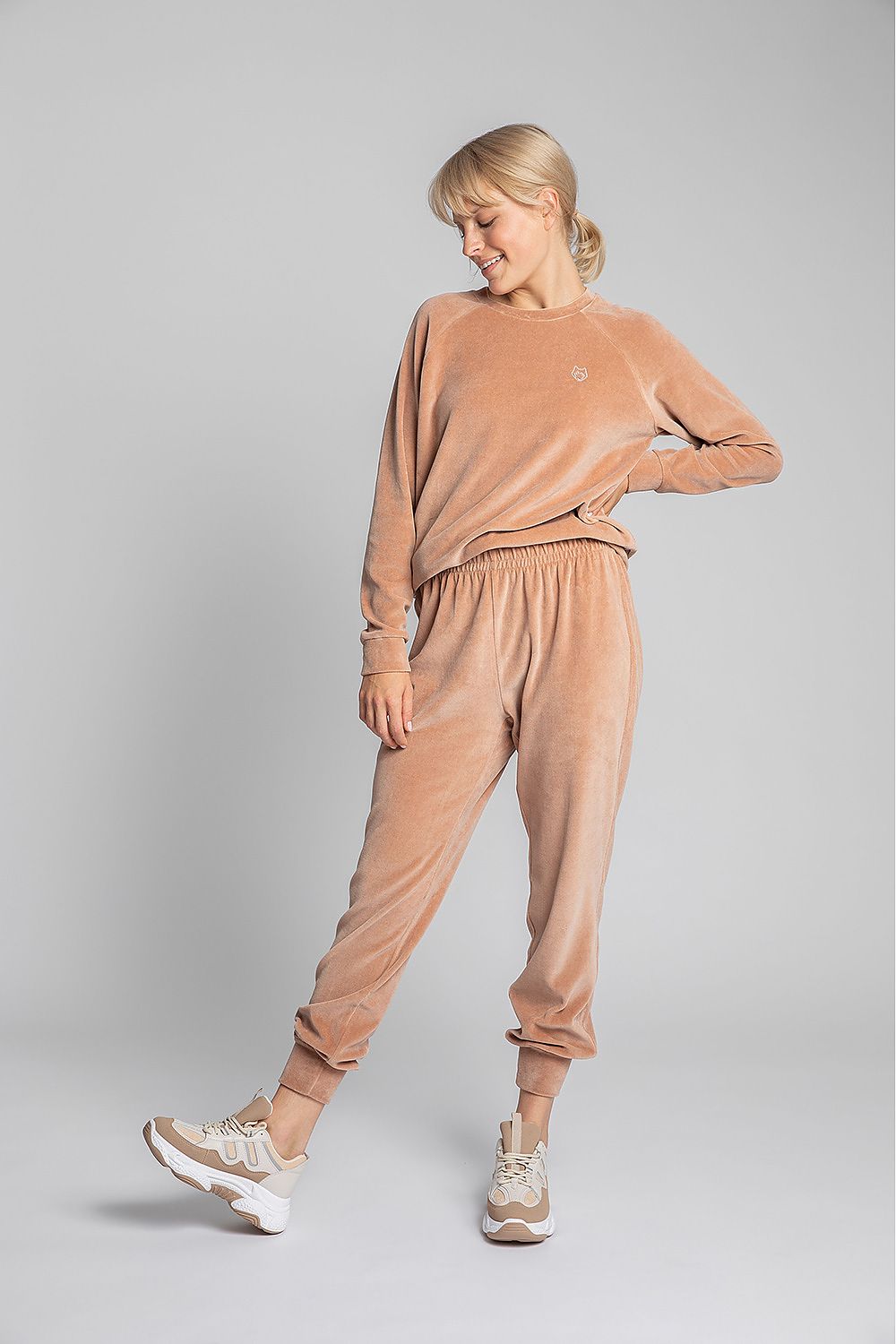 Unique light orange velour joggers. This slightly shiny cotton knit is pleasant to the touch and looks beautiful! Waistband with elastic.