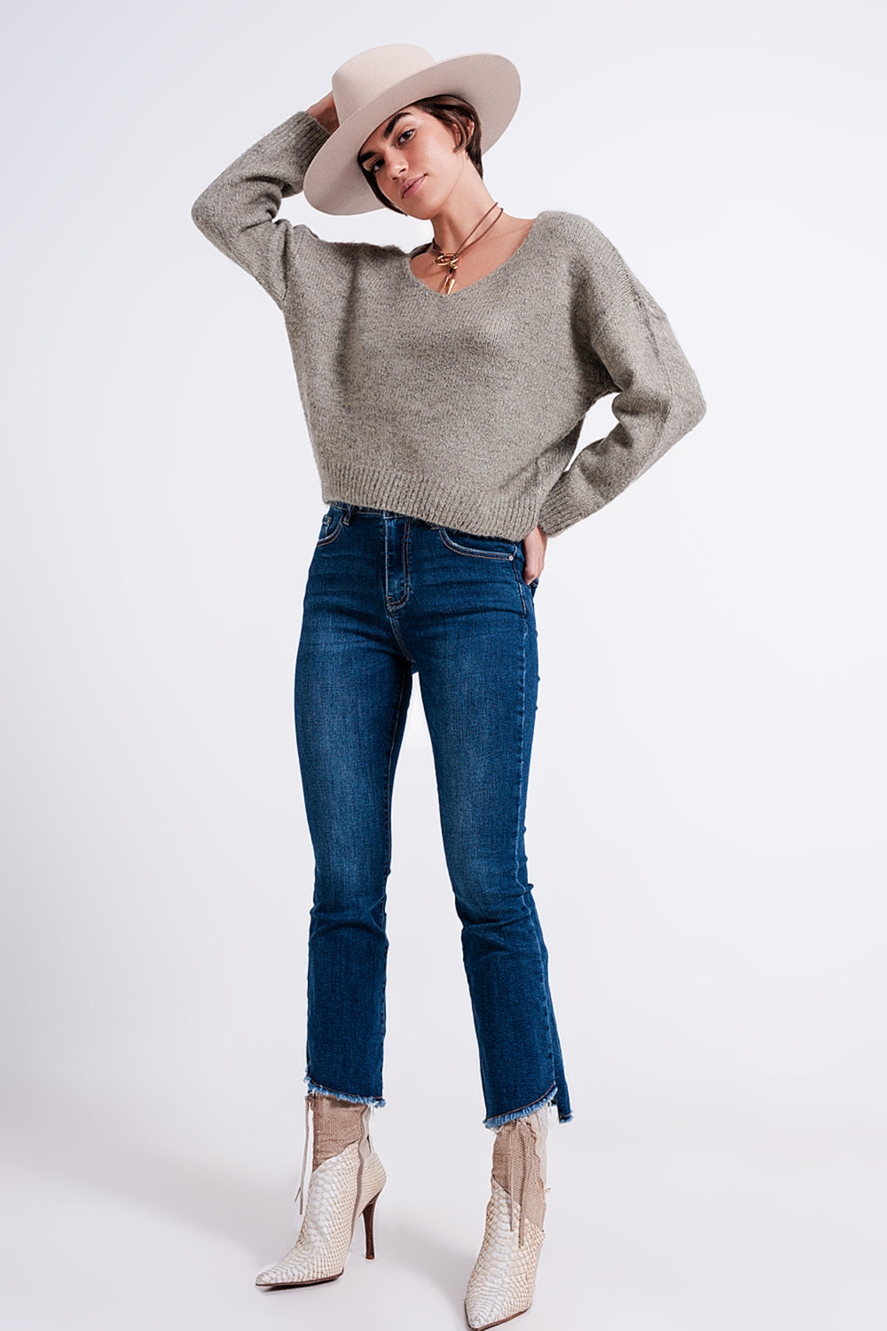 The Khaki Karma is a casual soft knit fluffy sweater with a V-neck, long sleeves and ribbed trims.