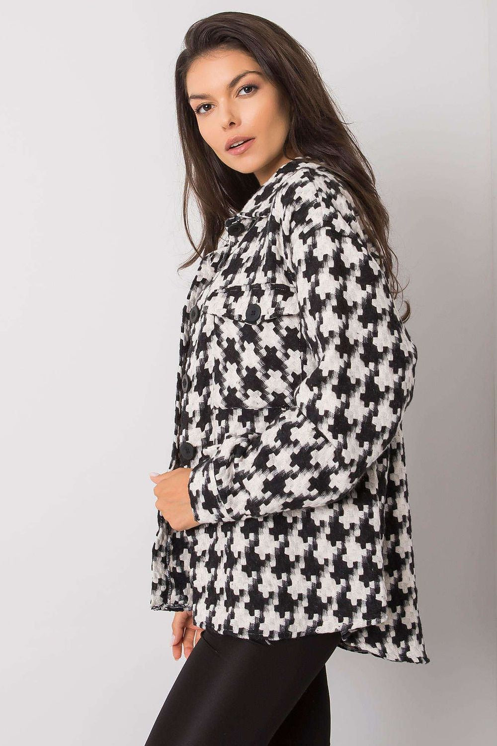 White and black women's button-down shirt. Pockets at the front. Perfect for Spring.