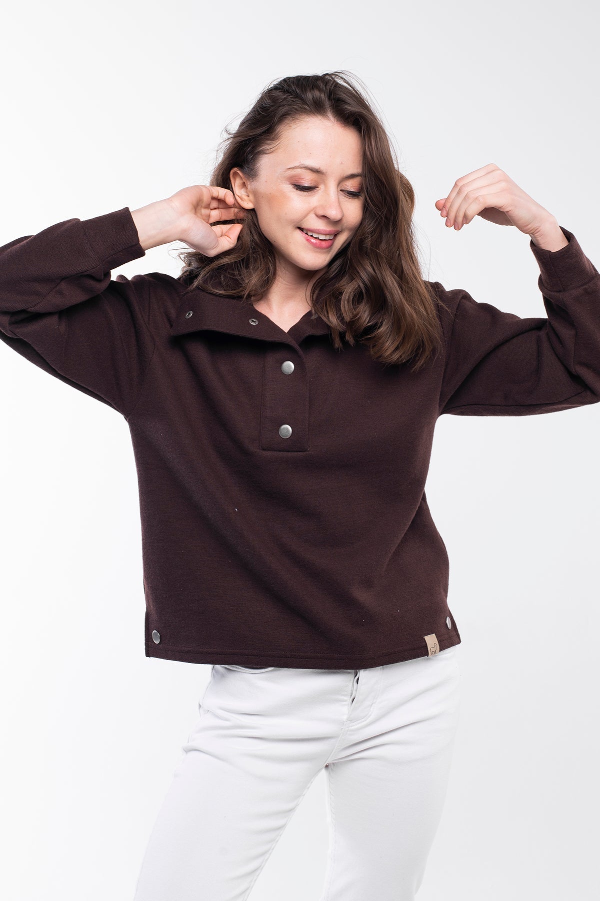 Highland Sweater - A versatile sweater made of 75% Polyester, 20% Viscose, and 5% Spandex with a buttoned high neck. This sweater offers a relaxed and comfortable fit with side slits, a regular fit, and long sleeves. It's an eco-conscious product manufactured from surplus fabrics with minimal environmental impact and a strict policy against child labor, ensuring regular employment standards are applied.