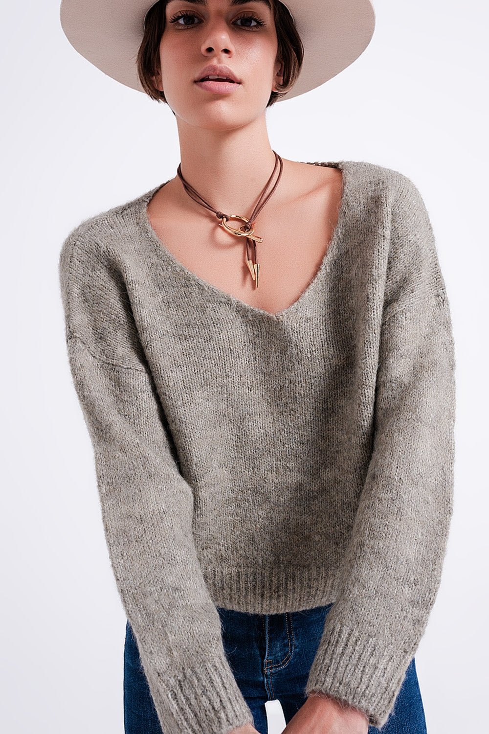 The Khaki Karma is a casual soft knit fluffy sweater with a V-neck, long sleeves and ribbed trims.
