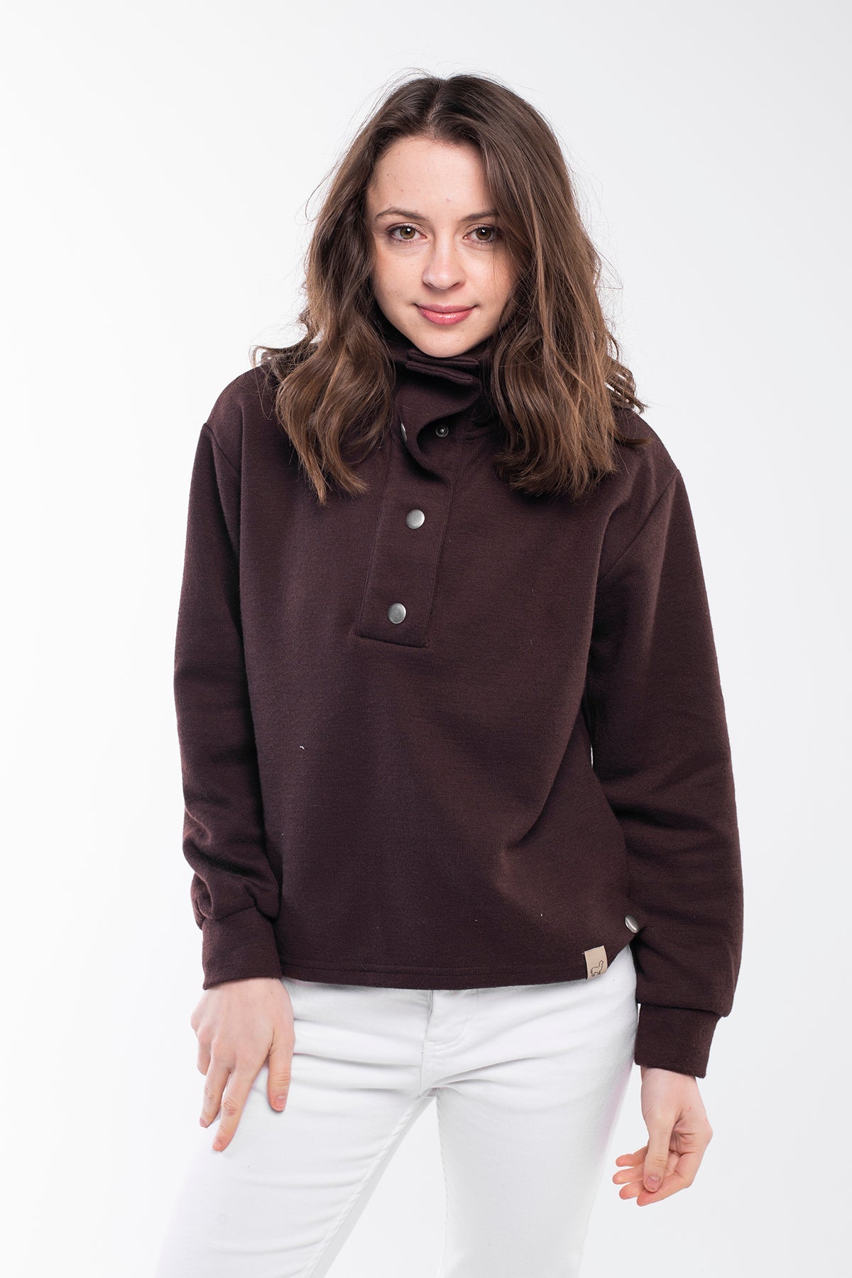 Highland Sweater - A versatile sweater made of 75% Polyester, 20% Viscose, and 5% Spandex with a buttoned high neck. This sweater offers a relaxed and comfortable fit with side slits, a regular fit, and long sleeves. It's an eco-conscious product manufactured from surplus fabrics with minimal environmental impact and a strict policy against child labor, ensuring regular employment standards are applied.