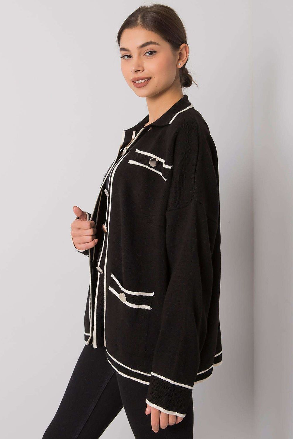 Black button-down cardigan with white lines and slip pockets.