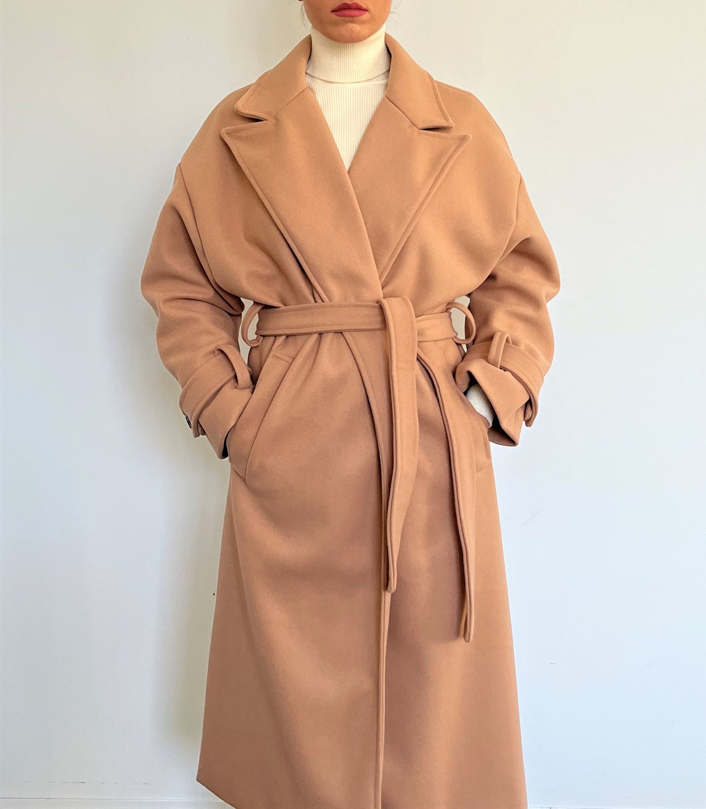 The Livia is a classic and timeless piece made in Italy. It is a must-have long coat for a fashionable winter. Colour: Camel.