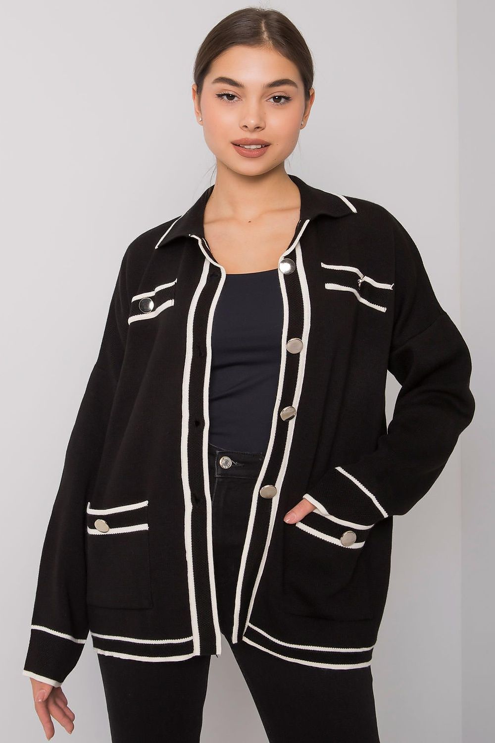 Black button-down cardigan with white lines and slip pockets.