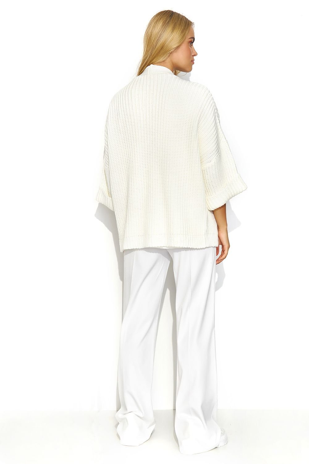 A white buttonless cardigan with wide sleeves and a lot of character. This cardigan has a uniform and regular pattern. It looks great when paired with a dress or a simple t-shirt and jeans. It is a versatile piece that adds exceptional class to both casual and more formal outfits. Made in Europe.