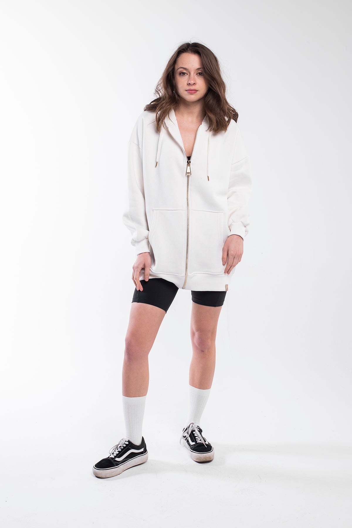 Oversized hoodie with a lined drawstring hood, front zip and kangaroo pockets for keeping your stuff secure. It has a relaxed design with dropped shoulders, long sleeves and handwriting embroidery on the wrist. This product is manufactured from surplus fabrics with minimum environmental impact where child labour is strictly prohibited and regular employment policies are applied.