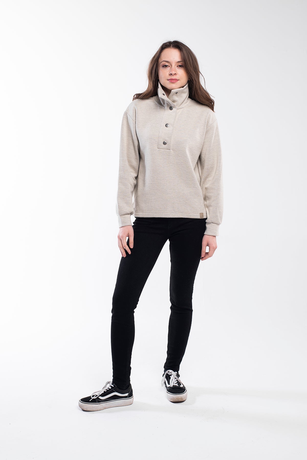 Highland Sweater - A versatile sweater made of 75% Polyester, 20% Viscose, and 5% Spandex with a buttoned high neck. This sweater offers a relaxed and comfortable fit with side slits, a regular fit, and long sleeves. It's an eco-conscious product manufactured from surplus fabrics with minimal environmental impact and a strict policy against child labor, ensuring regular employment standards are applied.