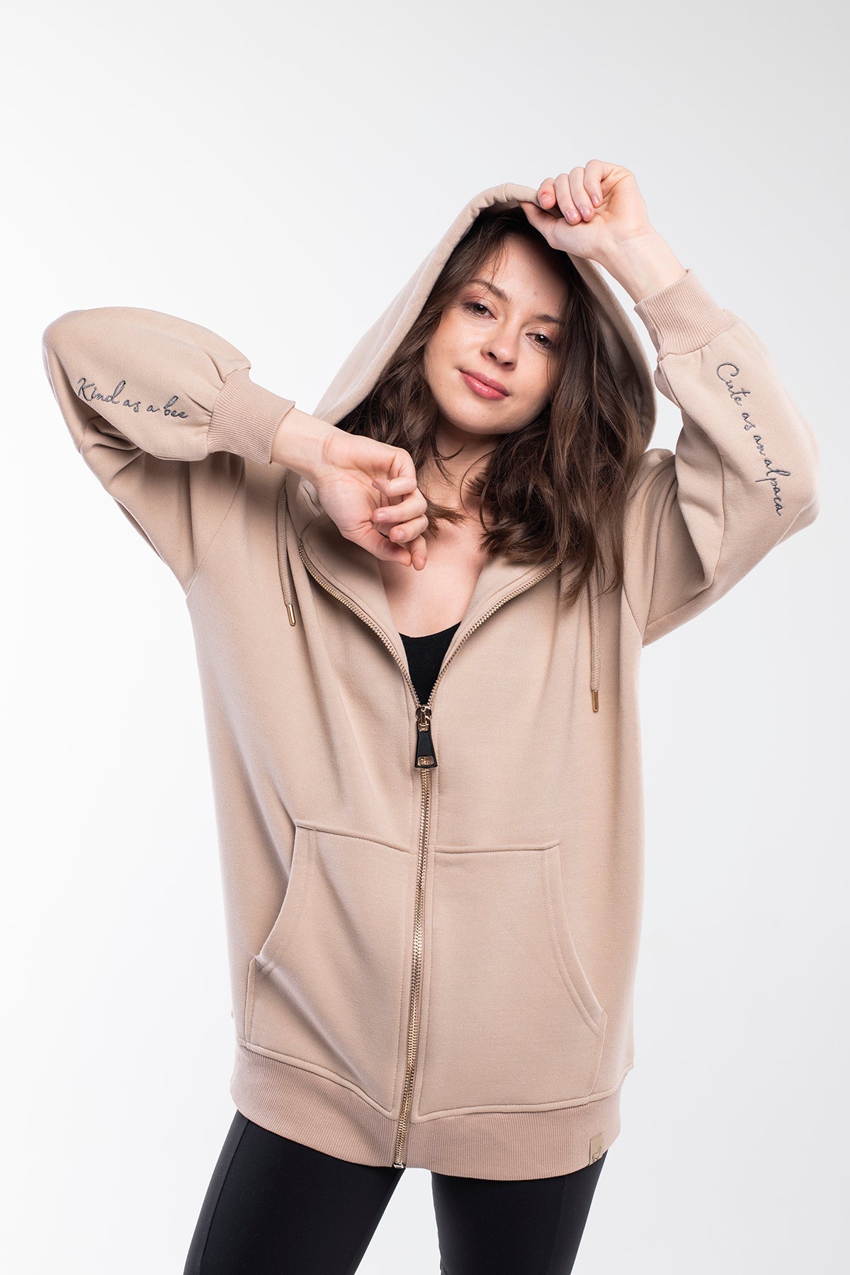 Oversized hoodie with a lined drawstring hood, front zip and kangaroo pockets for keeping your stuff secure. It has a relaxed design with dropped shoulders, long sleeves and handwriting embroidery on the wrist. This product is manufactured from surplus fabrics with minimum environmental impact where child labour is strictly prohibited and regular employment policies are applied.