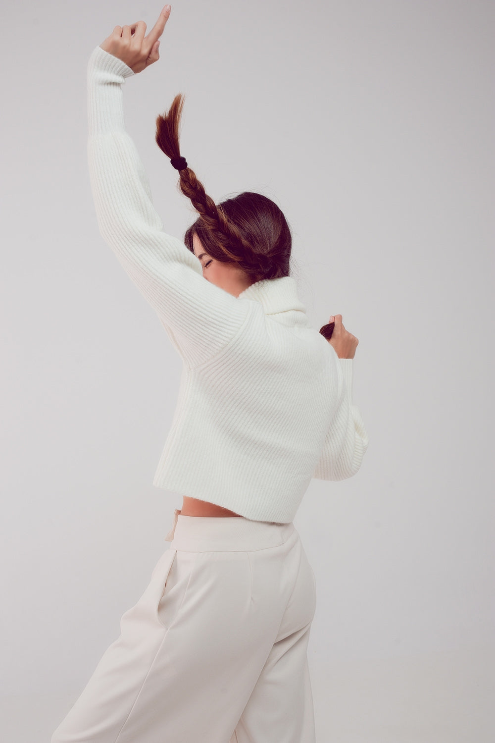 The White Winter Turtleneck Sweater is a must-have. This sweater boasts a cozy chunky knit fabric and stylish puff sleeves, blending comfort and fashion effortlessly. It's made from a blend of 45% Acrylic, 28% Polyamide, and 27% Polyester. With a standard fit that runs true to size, this sweater is designed to provide a comfortable and stylish look. Embrace the perfect combination of comfort and chic style.