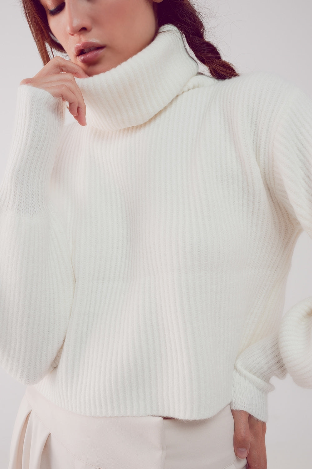 The White Winter Turtleneck Sweater is a must-have. This sweater boasts a cozy chunky knit fabric and stylish puff sleeves, blending comfort and fashion effortlessly. It's made from a blend of 45% Acrylic, 28% Polyamide, and 27% Polyester. With a standard fit that runs true to size, this sweater is designed to provide a comfortable and stylish look. Embrace the perfect combination of comfort and chic style.