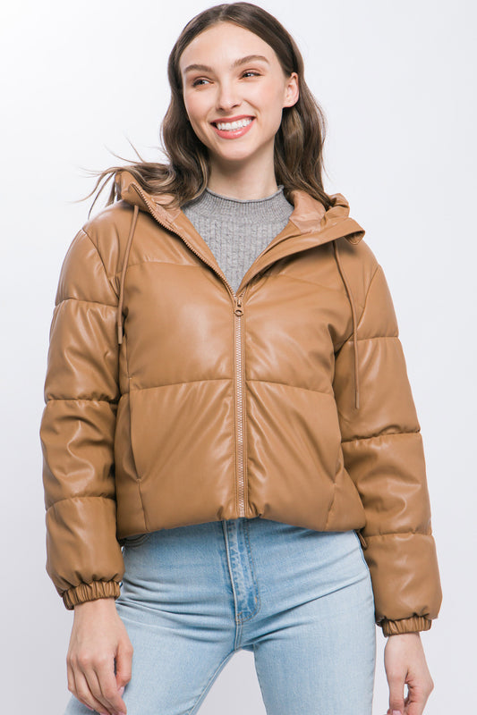 The Celine is our faux leather hooded puffer jacket. Tailored for maximum comfort, this jacket is perfect for all-day wear. Whether you're heading to a casual outing or for a night out downtown, this jacket is a versatile choice for any occasion. Fabric: Crafted from 100% Polyurethane Faux Leather. Colour: camel.