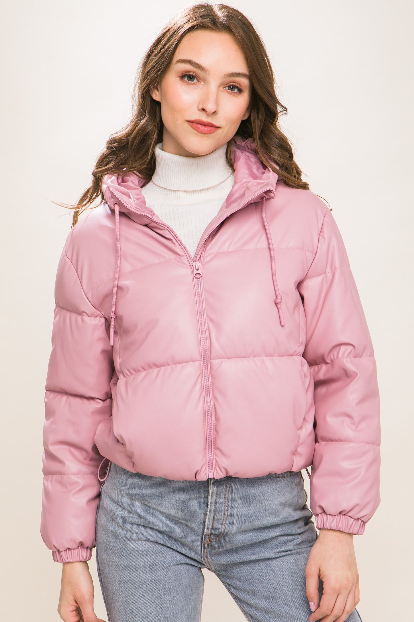 The Celine is our faux leather hooded puffer jacket. Tailored for maximum comfort, this jacket is perfect for all-day wear. Whether you're heading to a casual outing or for a night out downtown, this jacket is a versatile choice for any occasion. Fabric: Crafted from 100% Polyurethane Faux Leather. Colour: pink.