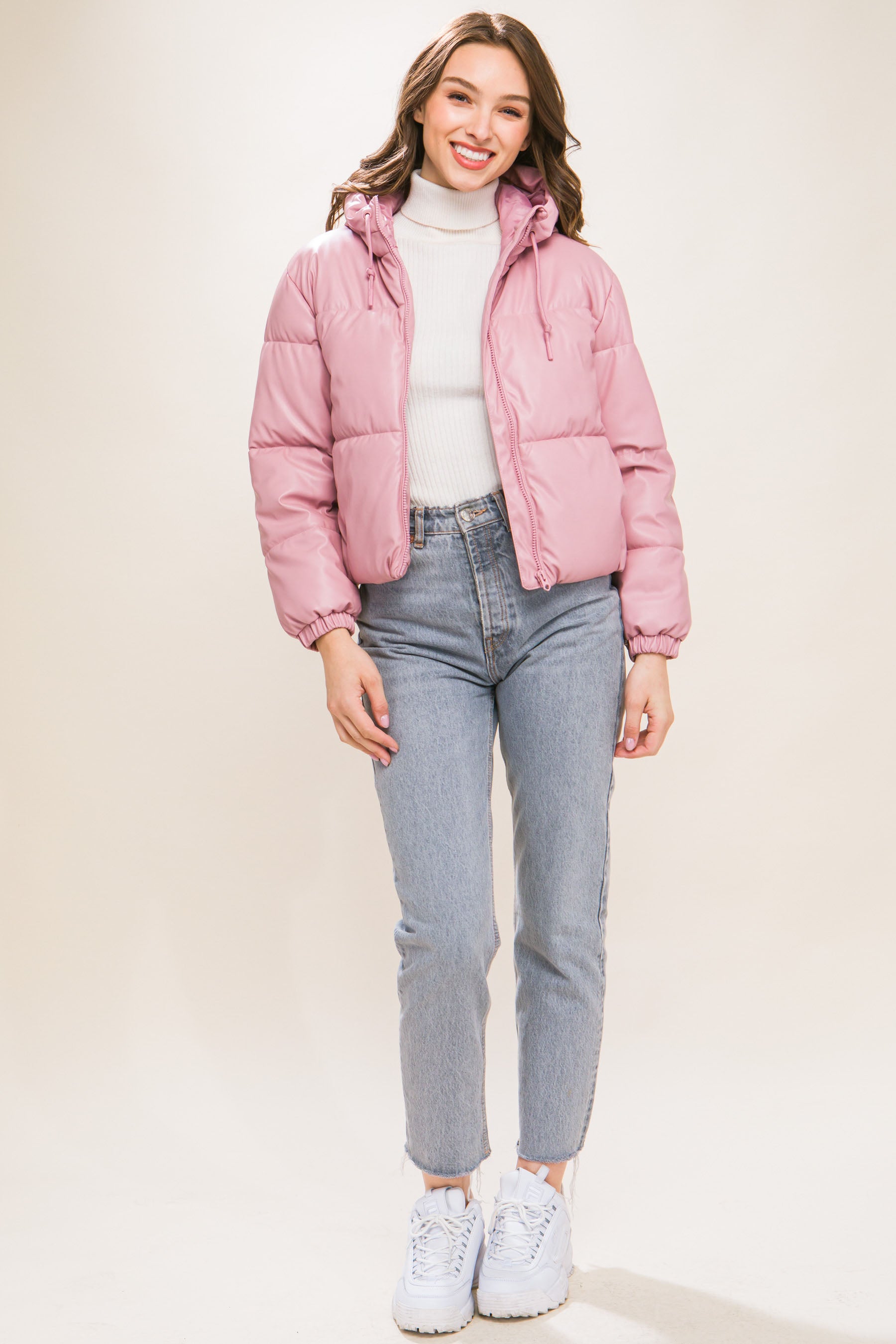 The Celine is our faux leather hooded puffer jacket. Tailored for maximum comfort, this jacket is perfect for all-day wear. Whether you're heading to a casual outing or for a night out downtown, this jacket is a versatile choice for any occasion. Fabric: Crafted from 100% Polyurethane Faux Leather. Colour: pink.