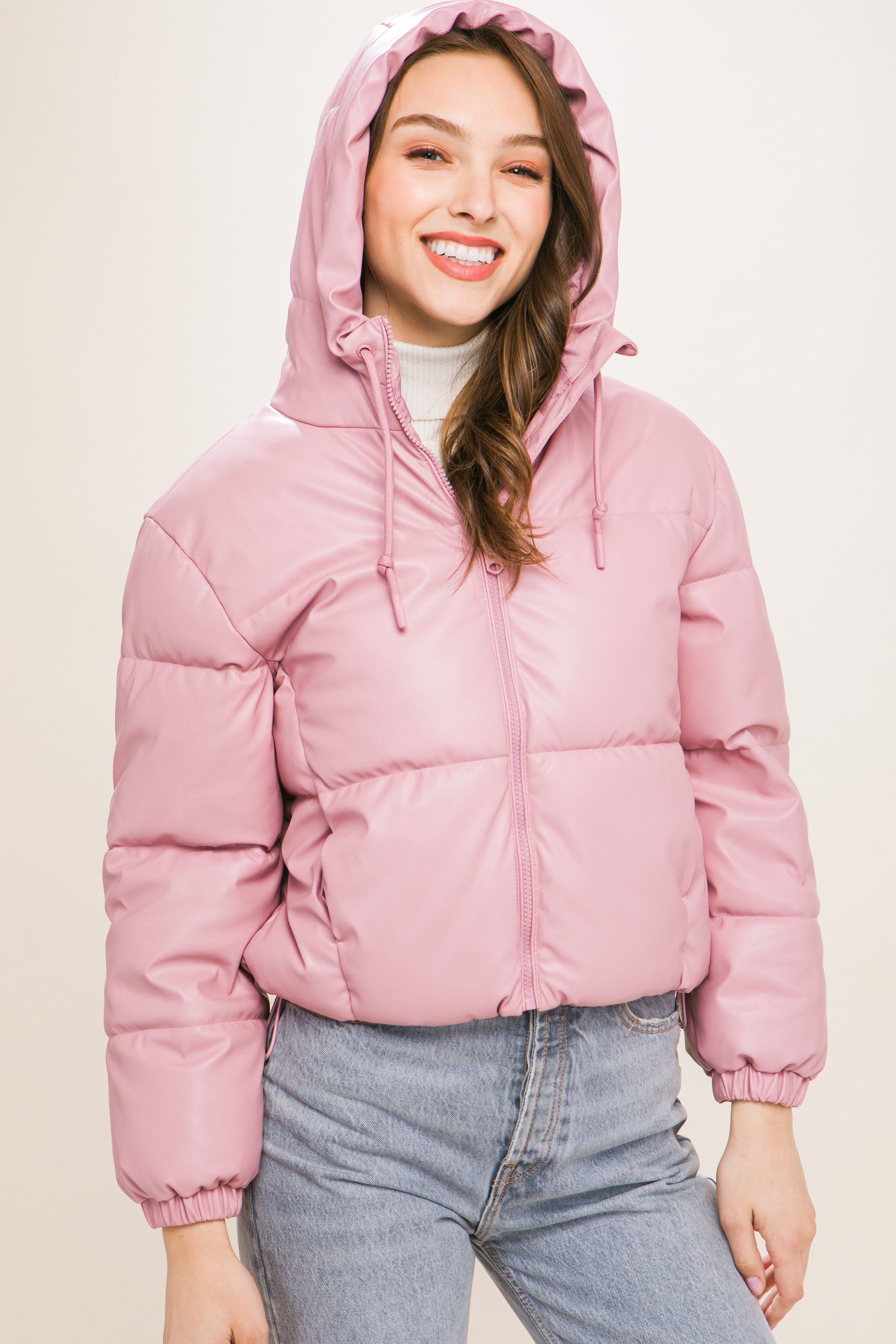 The Celine is our faux leather hooded puffer jacket. Tailored for maximum comfort, this jacket is perfect for all-day wear. Whether you're heading to a casual outing or for a night out downtown, this jacket is a versatile choice for any occasion. Fabric: Crafted from 100% Polyurethane Faux Leather. Colour: pink.