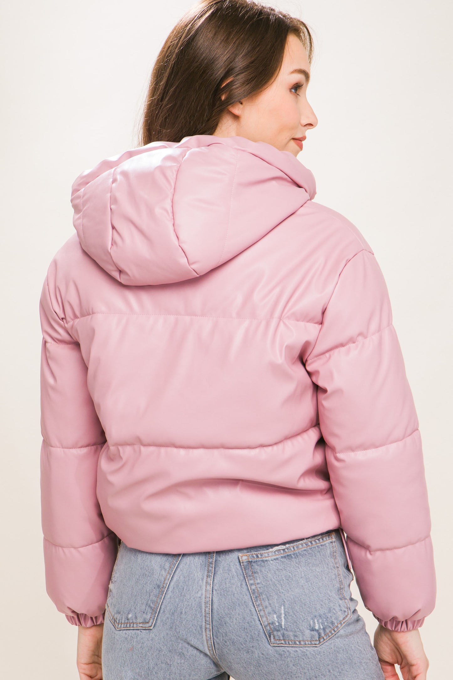 The Celine is our faux leather hooded puffer jacket. Tailored for maximum comfort, this jacket is perfect for all-day wear. Whether you're heading to a casual outing or for a night out downtown, this jacket is a versatile choice for any occasion. Fabric: Crafted from 100% Polyurethane Faux Leather. Colour: pink.