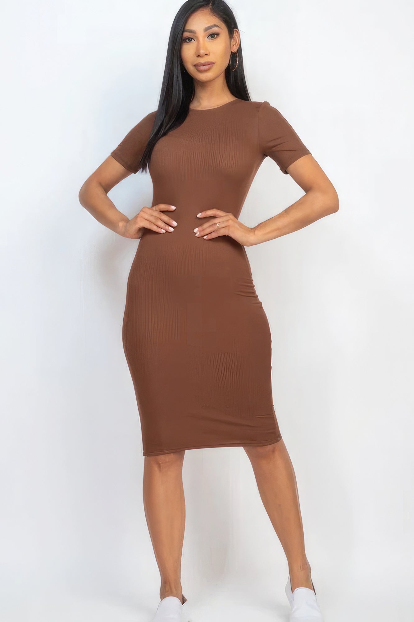 Introducing The Sarah, a sophisticated and versatile addition to your wardrobe that seamlessly combines comfort and style. This midi dress, available in a rich downtown brown colour, is crafted from a blend of 92% Polyester and 8% Spandex, to give you a flattering silhouette. Perfect for a night out, special events, or any occasion where you want to make a statement.